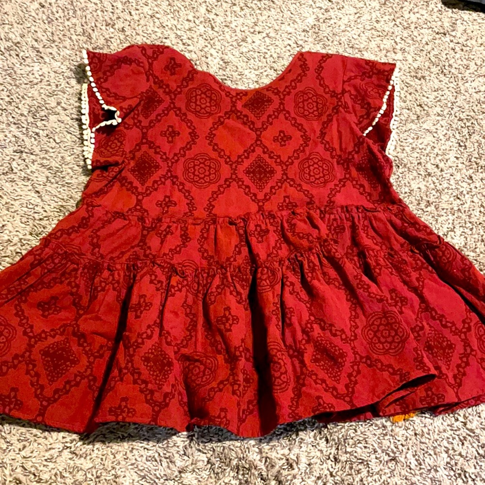 Boho top with tasseled close on back